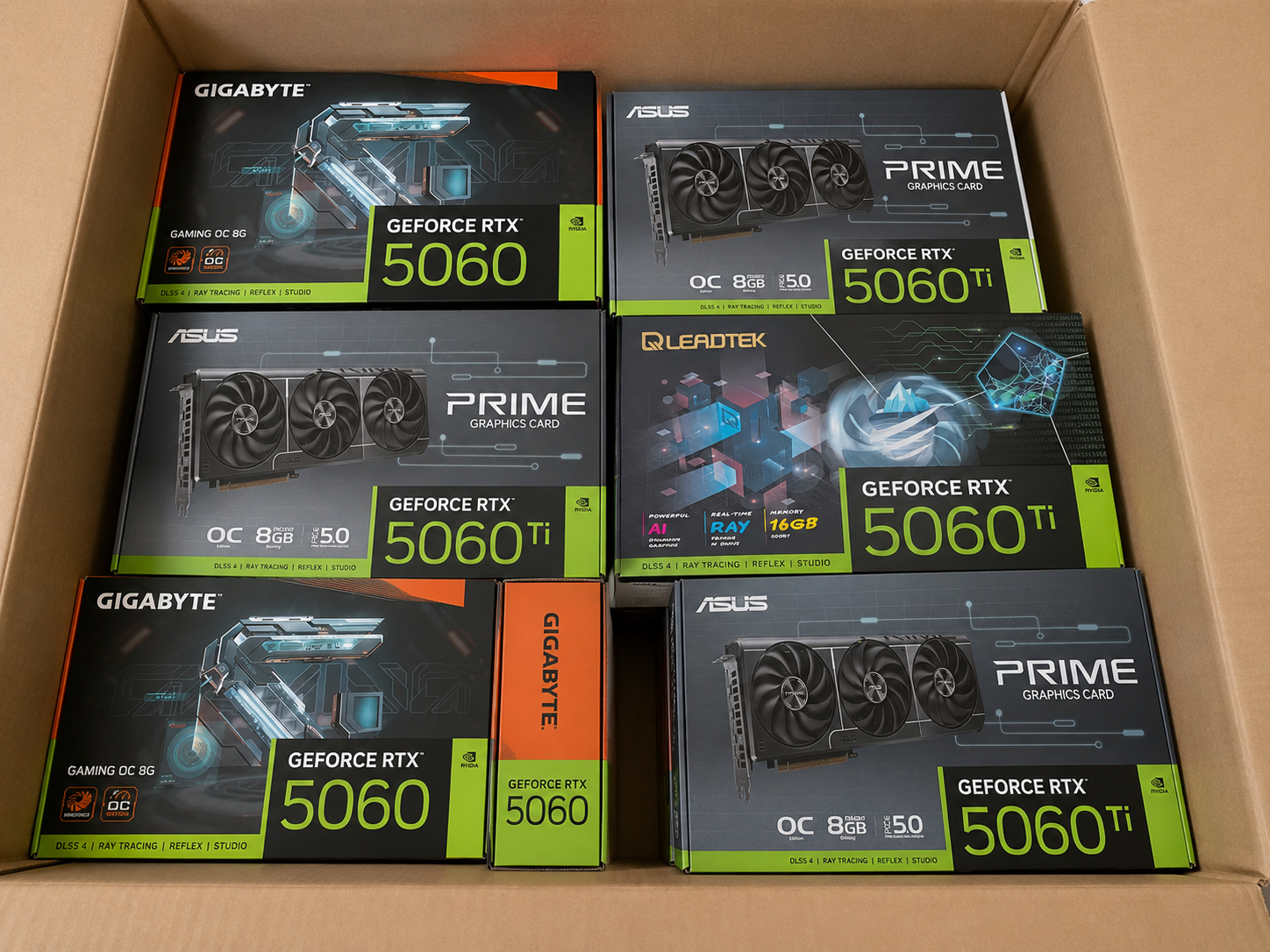 Shipping carton packed with boxed graphics cards and computer components